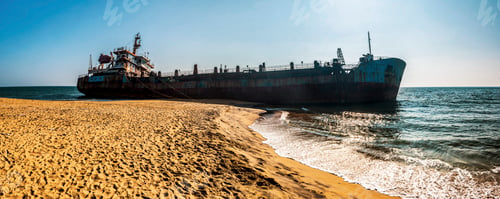 Preview: Old, rusty shipwreck on a beach in Varkala, Kerala, India