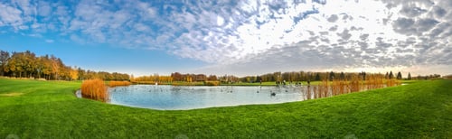 Preview: Pond and green meadow in autumn park, panorama