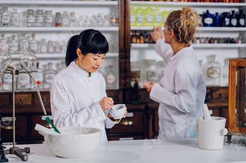 Preview: A Japanese pharmacist is mixing medicine while her assistant is looking for more ingredients