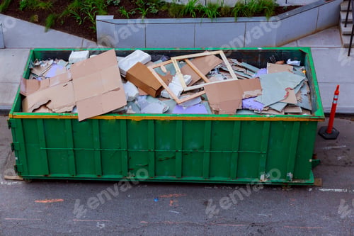 Preview: Construction waste in an metal container, home house renovation. container for construction waste