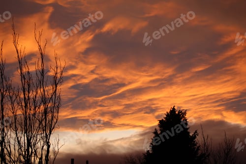 Preview: Panoramic shot of orange clouds on the sky during sunset
