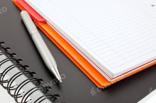 Preview: pen and two paper notebooks