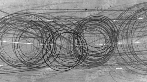 Preview: Aerial view tire track mark on asphalt tarmac road race track texture and background.
