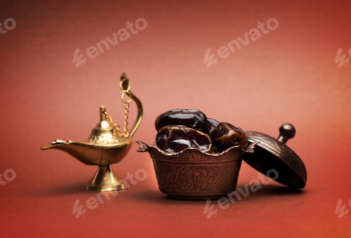 Preview: Dates and lamp aladdin on dark background
