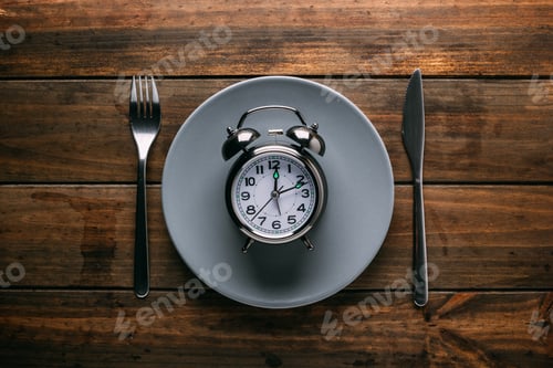 Preview: Cutlery near plate with alarm clock