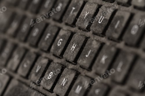 Preview: old black keyboard with keys covered in dust and dirt isolated on white background
