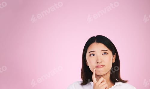 Preview: Asian woman, thinking and mockup space in solution, memory or ideas against a pink studio backgroun