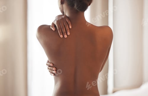Preview: Rearview shot of a young woman posing topless