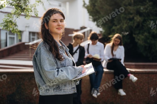 Preview: Group of students are near university together