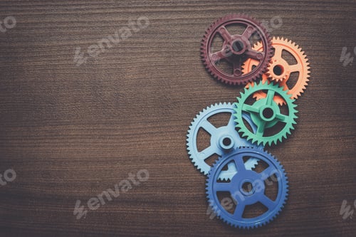 Preview: colorful gears on the wooden background