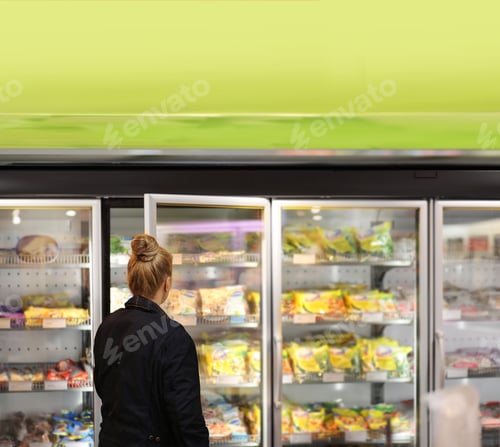 Preview: Woman Choosing Frozen Food From A Supermarket Freezer