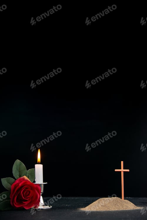 Preview: little grave with candles and flower as memory on dark surface israel death palestine funeral