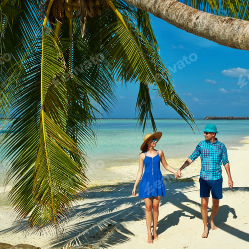 Preview: Couple In Blue Clothes On A Tropical Beach At Maldives
