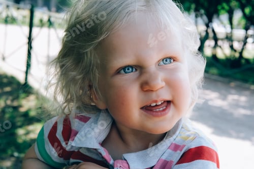 Preview: Little child walking in a park