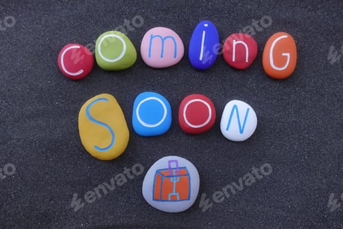 Preview: Coming soon text with colored stones design over black volcanic sand