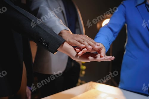 Preview: Business team joining hands together in office meeting showing support, unity, teamwork and trust