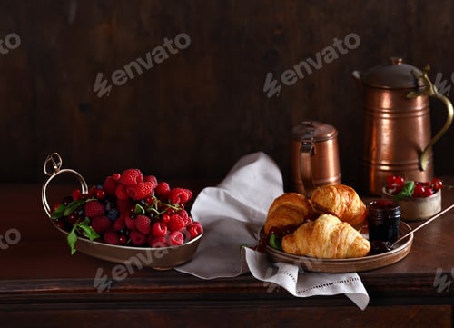 Preview: traditional breakfast of croissants, coffee and fresh berries