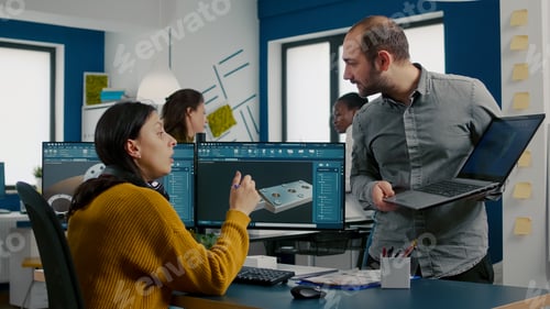 Preview: Engineers talking in front on pc and laptop with CAD software