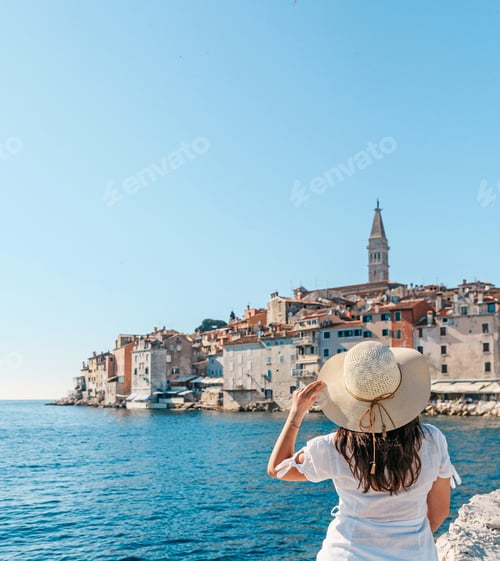 Preview: Beautiful shot of a female looking at the cityscape of Rovinj City in Croatia