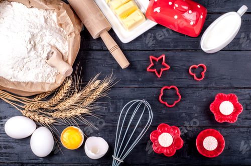 Preview: Ingredients for baking. Flour in paper bag, butter, milk, wheat, eggs and kitchen utensils