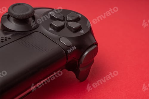 Preview: Closeup shot of a game controller on a red background