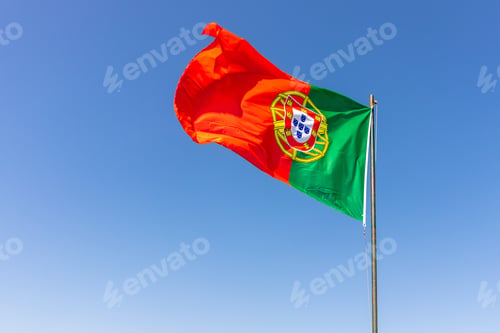 Preview: Beautiful shot of the Portuguese flag waving in the calm bright sky