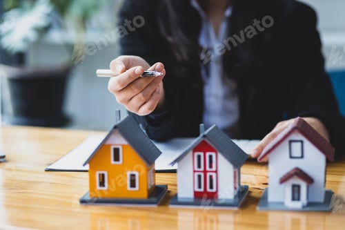 Preview: Real estate agent is showing a model home, The concept of buying and selling homes and rental homes.