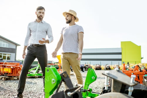 Preview: Agronomist with salesman at the agricultural shop