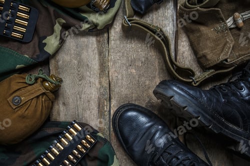 Preview: Army military uniform, weapon, holster, pistol, flask, boots on wooden background. Flat lay top view