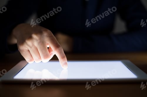 Preview: Woman finger touch on the screen of digital tablet
