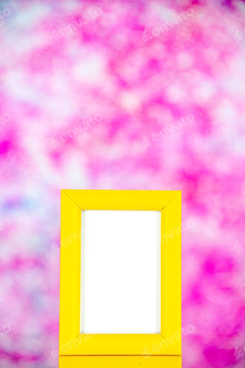 Preview: front view yellow picture frame on light pink background portrait photo color shoot present gift