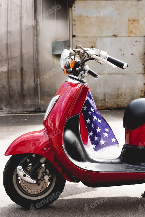 Preview: side view of red vwith American flag on handle