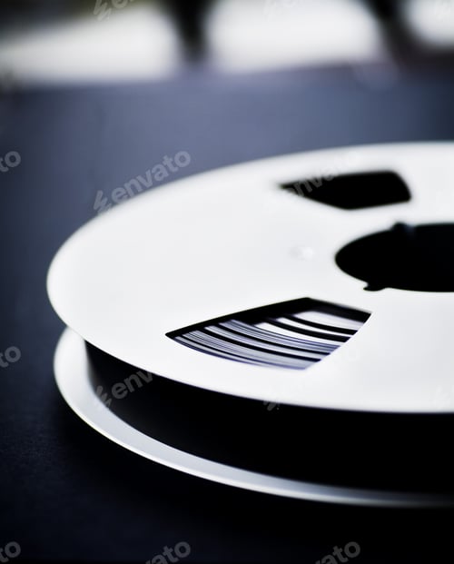 Preview: Close-up of film reel on table