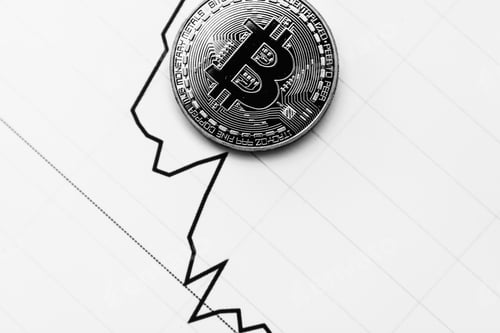 Decreasing Chart with a Single Bitcoin on Top