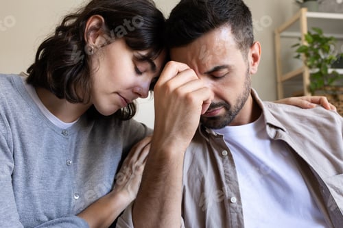 Preview: Close up of woman comforting husband.