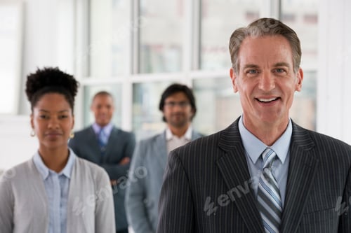 Preview: Business people. Four people, three men and a woman.