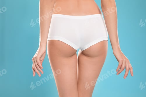 Preview: Slim young woman with smooth gentle skin on color background, closeup. Beauty and body care concept