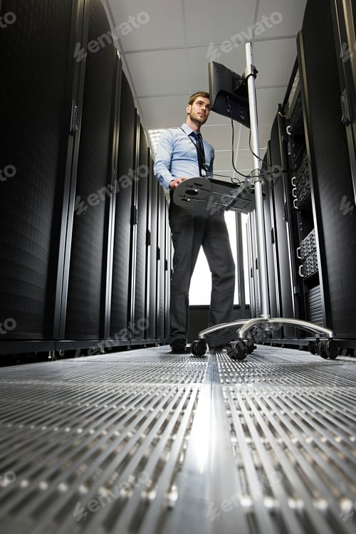 Preview: IT professional performing maintenance in server room