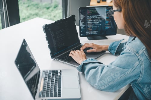 Preview: Female programmer working on coding, software development and web design.