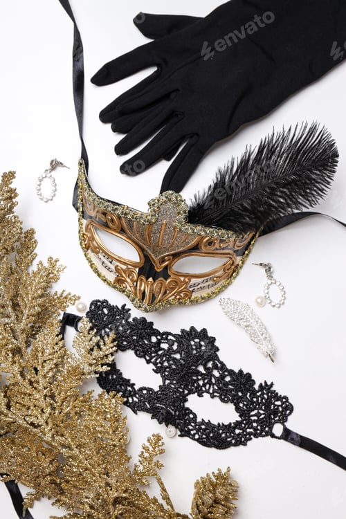 Preview: Carnival masks and gloves on white background, top view