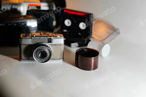 Preview: Vintage Camera and Film Roll with Retro Equipment