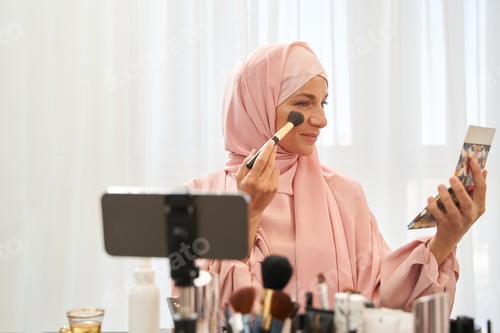Preview: Attractive Muslim woman taking care of her skin