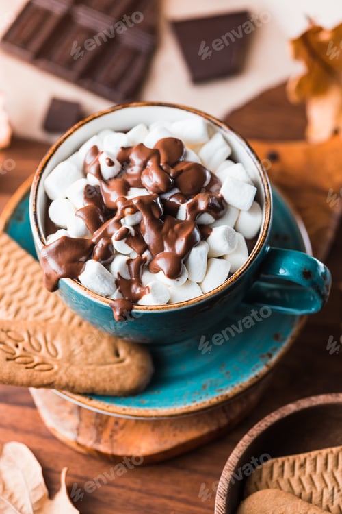 Preview: Close-up of hot chocolate with marshmallows on the table. Autumn or winter cozy still life.