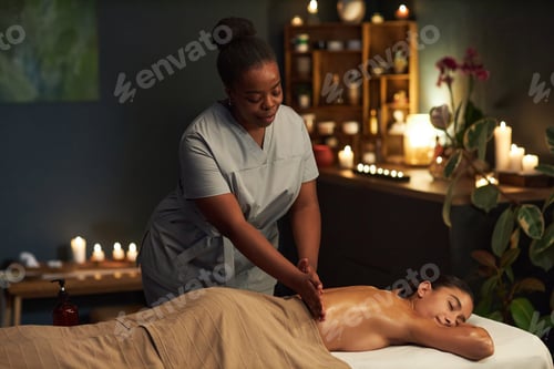 Preview: Spa Therapist Giving Relaxing Massage to Client