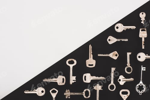 Preview: top view of different vintage keys over black and white background