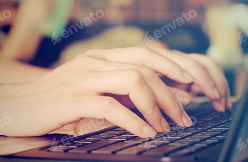Preview: Close up hands typing laptop
