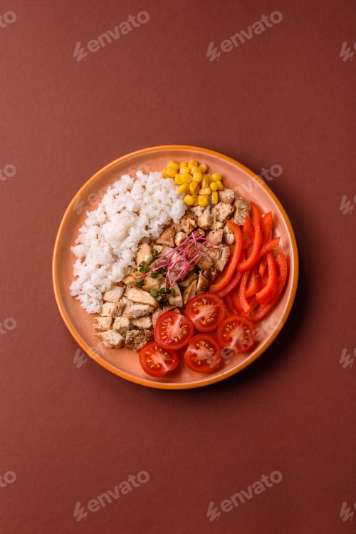 Preview: Bowl with chicken pieces, rice, tomatoes, peppers and microgreens. Bowl with chicken