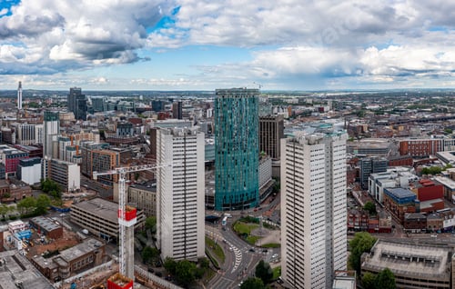 Preview: Aerial view of tall skyscrapers with the Radisson Blu hotel in the centre of Birmingham city skyline