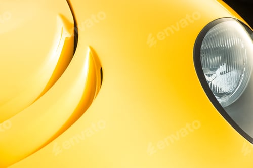 Bright Yellow Car Headlight Detail Abstract Background