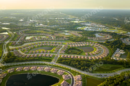 Preview: Aerial view of tightly located family houses with retention ponds to prevent flooding